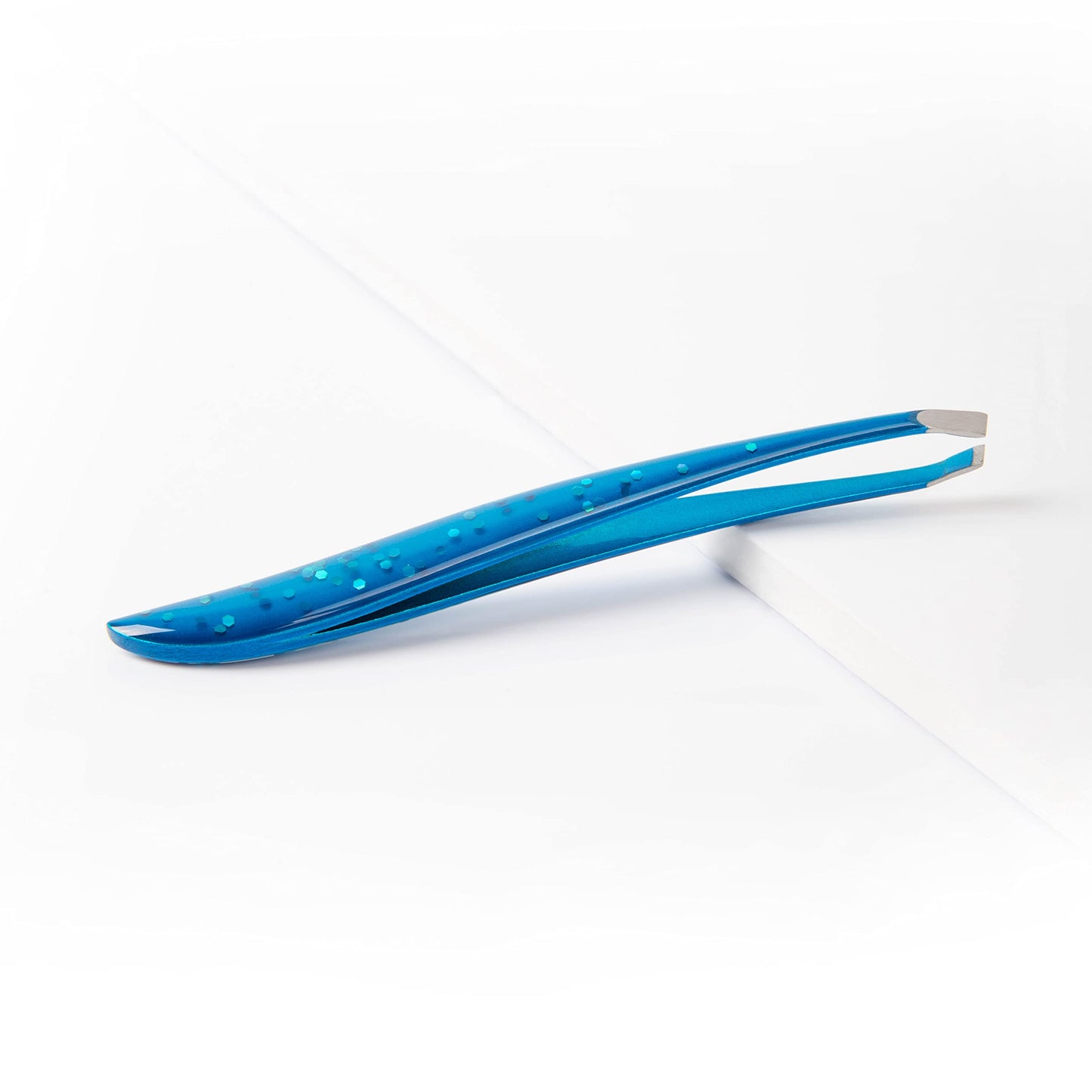 TRIM Azure Collection Slant Tip Tweezer - Precision-Ground Tips Grasp Even The Finest Hairs - Angled to Align with The Brow's Natural Arch - Calibrated Tension for More Control - Stainless Steel